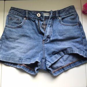 Blue high wasted denim shorts.